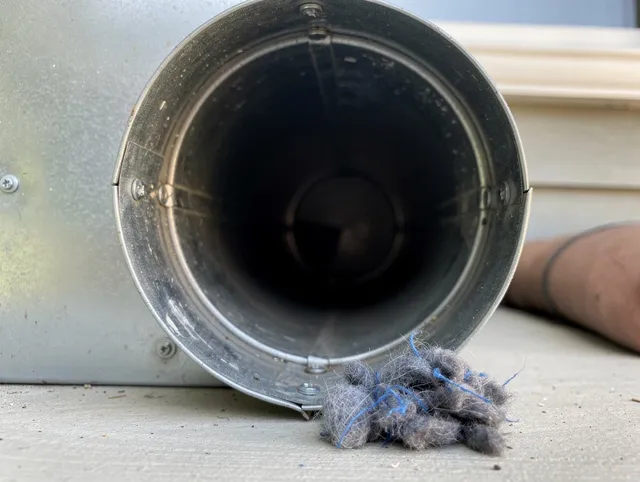 Melbourne Dryer Vent Cleaning technician using specialized equipment to clear severe dryer vent blockage in Melbourne